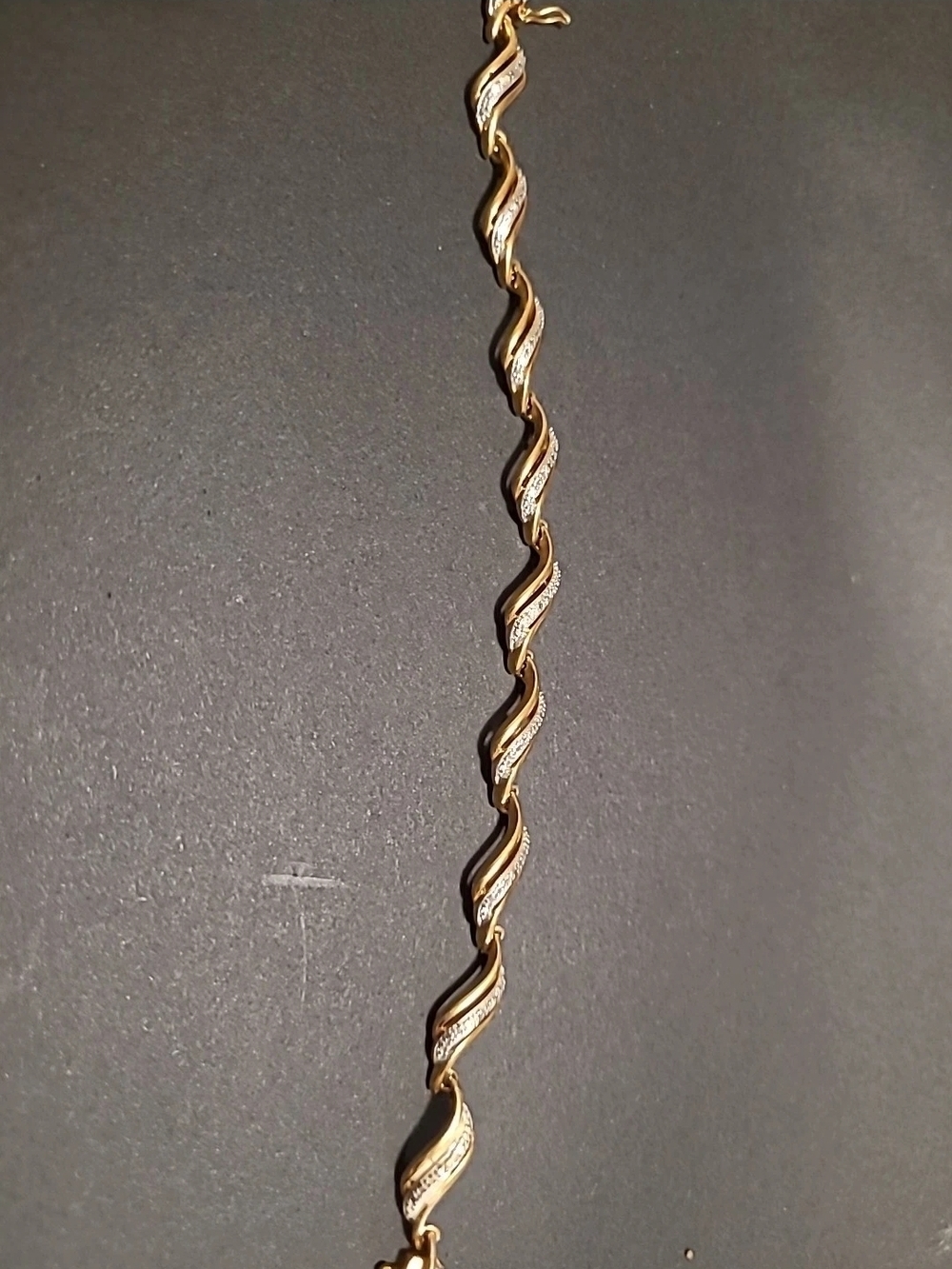 Gold Tone Wavy Link Bracelet with Crystal Accents